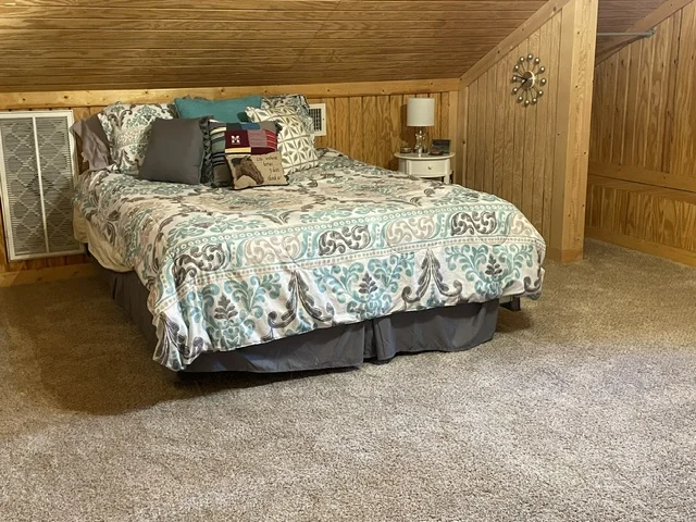 Made bed and nightstand